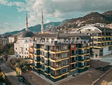 Двухкомнатные апартаменты стандартной площади 55 м² в новом доме в центре Аланьи-id-3328-фото-1