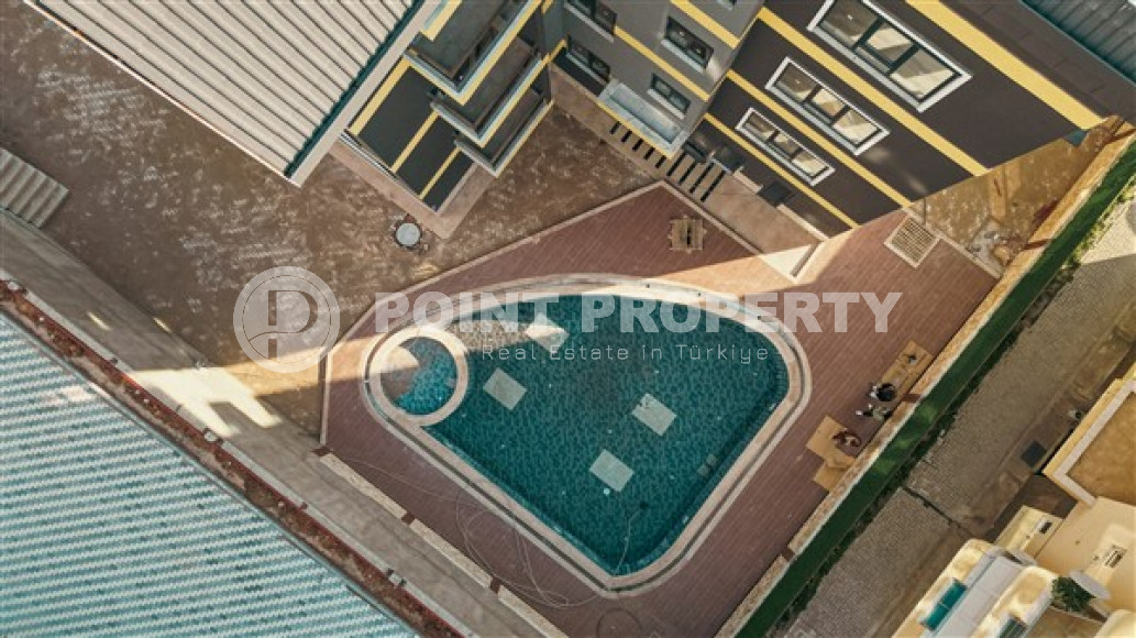 Двухкомнатные апартаменты стандартной площади 55 м² в новом доме в центре Аланьи-id-3328-фото-3