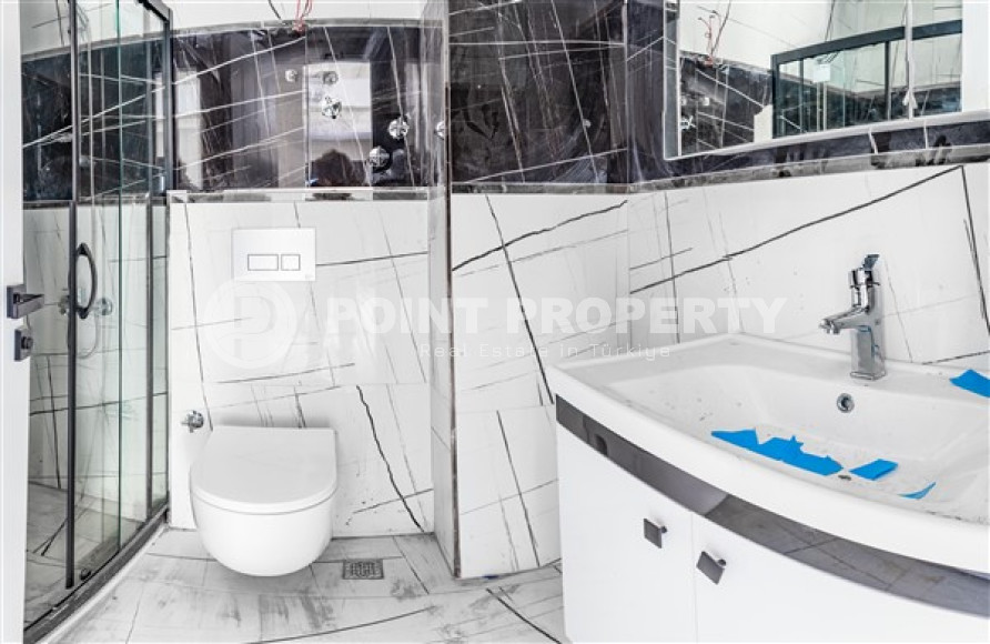 Двухкомнатные апартаменты стандартной площади 55 м² в новом доме в центре Аланьи-id-3328-фото-6