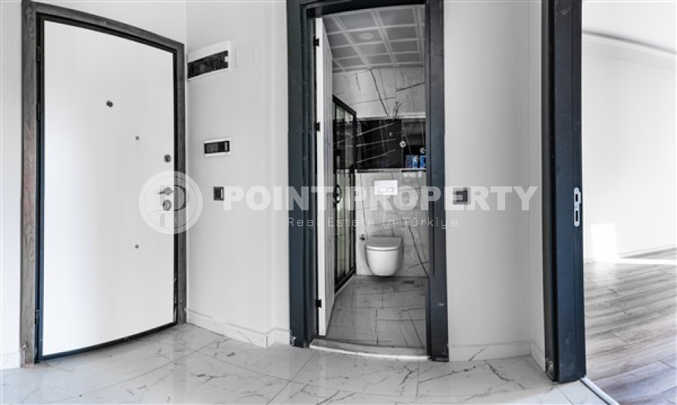 Двухкомнатные апартаменты стандартной площади 55 м² в новом доме в центре Аланьи-id-3328-фото-8