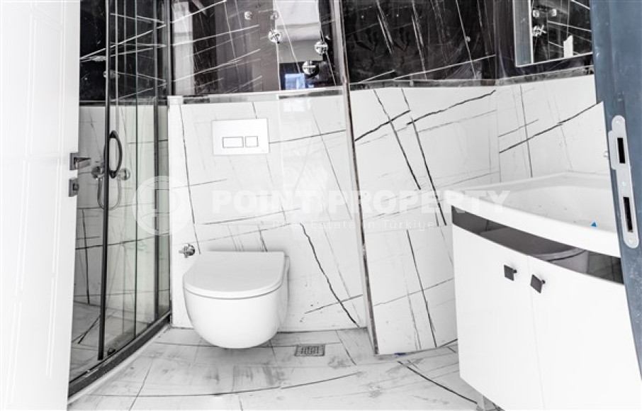 Двухкомнатные апартаменты стандартной площади 55 м² в новом доме в центре Аланьи-id-3328-фото-10