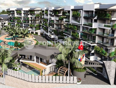 Новый крупный проект с квартирами и виллами от 63 до 425 м2, с видом на море в районе Каргыджак.-id-1301-фото-2