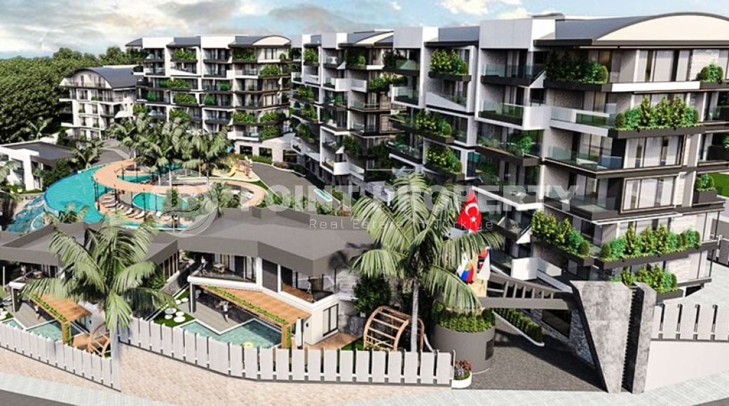 Новый крупный проект с квартирами и виллами от 63 до 425 м2, с видом на море в районе Каргыджак.-id-1301-фото-2