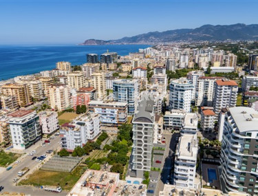 Apartment 1+1 and 60 m2 in a high-rise building under construction, Mahmutlar district, 100 meters from the center-id-3413-photo-2