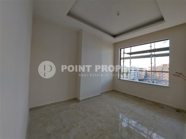 Apartment 1+1 and 60 m2 in a high-rise building under construction, Mahmutlar district, 100 meters from the center-id-3413-photo-7