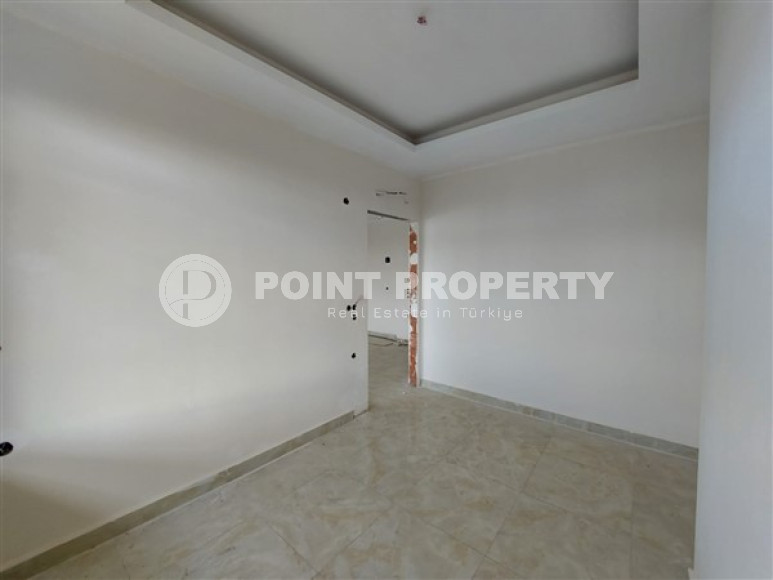 Apartment 1+1 and 60 m2 in a high-rise building under construction, Mahmutlar district, 100 meters from the center-id-3413-photo-8