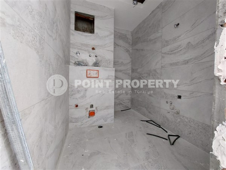 Apartment 1+1 and 60 m2 in a high-rise building under construction, Mahmutlar district, 100 meters from the center-id-3413-photo-9