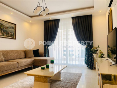 Modern 1+1 apartment with an area of 65 m2 in the Mahmutlar area, furnished-id-3473-photo-1
