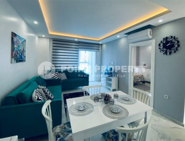 Inexpensive 1+1 apartment with an area of 65 m2 just 350 meters from the sea, Mahmutlar district-id-3495-photo-1