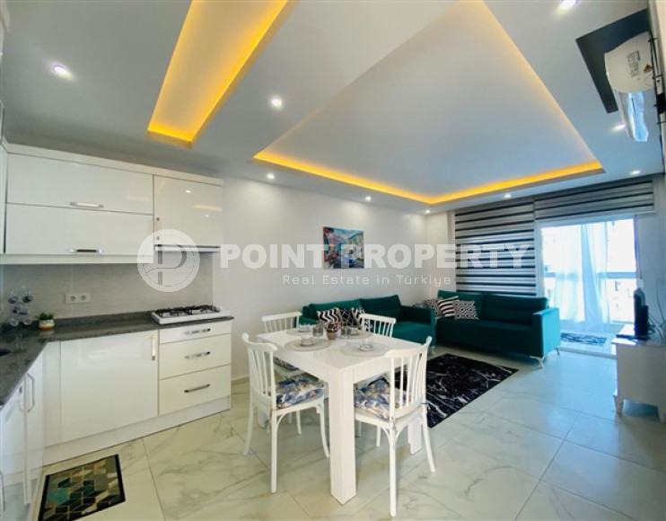 Недорогие апартаменты 1+1 с площадью 65 м2 всего в 350 метрах от моря, район Махмутлар-id-3495-фото-2