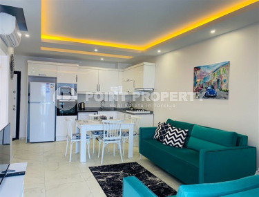 Недорогие апартаменты 1+1 с площадью 65 м2 всего в 350 метрах от моря, район Махмутлар-id-3495-фото-4