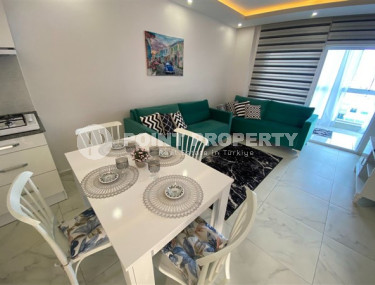 Недорогие апартаменты 1+1 с площадью 65 м2 всего в 350 метрах от моря, район Махмутлар-id-3495-фото-5