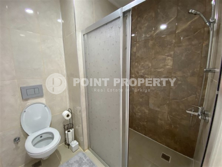 Недорогие апартаменты 1+1 с площадью 65 м2 всего в 350 метрах от моря, район Махмутлар-id-3495-фото-12