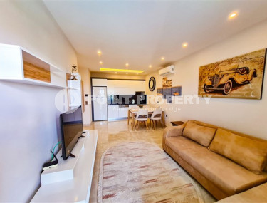 Апартаменты 1+1 в ультрасовременном жилом комплексе на берегу моря в центре района Махмутлар-id-3516-фото-1