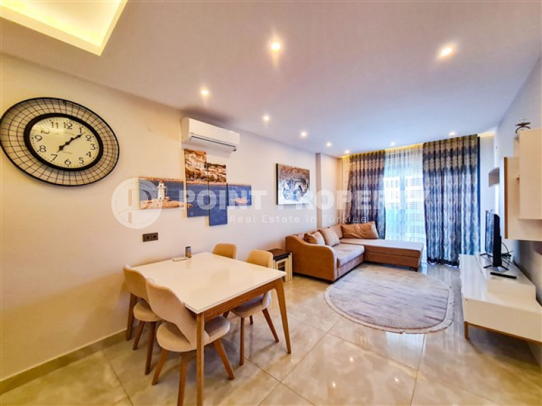 Апартаменты 1+1 в ультрасовременном жилом комплексе на берегу моря в центре района Махмутлар-id-3516-фото-2