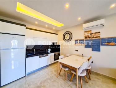 Апартаменты 1+1 в ультрасовременном жилом комплексе на берегу моря в центре района Махмутлар-id-3516-фото-3