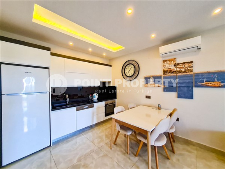 Апартаменты 1+1 в ультрасовременном жилом комплексе на берегу моря в центре района Махмутлар-id-3516-фото-3