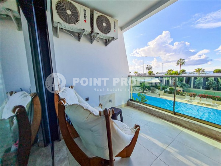 Апартаменты 1+1 в ультрасовременном жилом комплексе на берегу моря в центре района Махмутлар-id-3516-фото-6