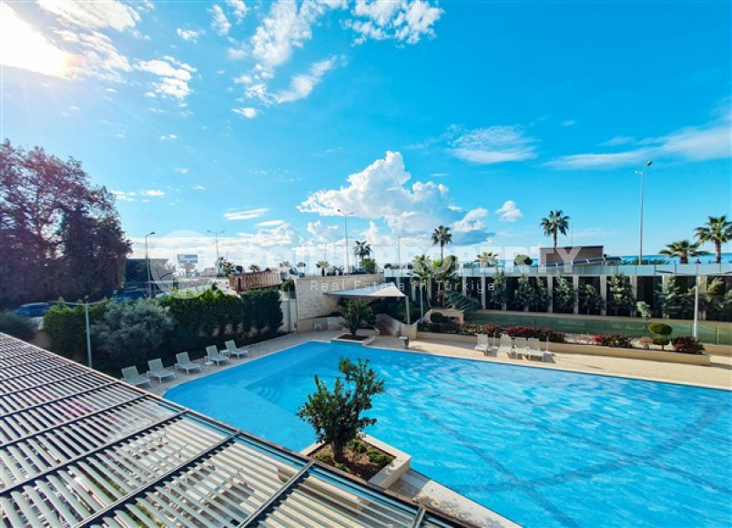 Апартаменты 1+1 в ультрасовременном жилом комплексе на берегу моря в центре района Махмутлар-id-3516-фото-7