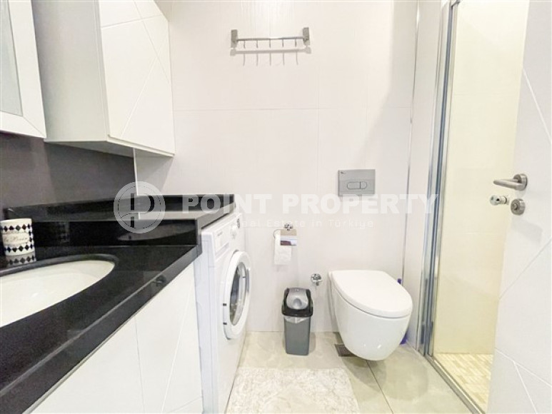 Апартаменты 1+1 в ультрасовременном жилом комплексе на берегу моря в центре района Махмутлар-id-3516-фото-9