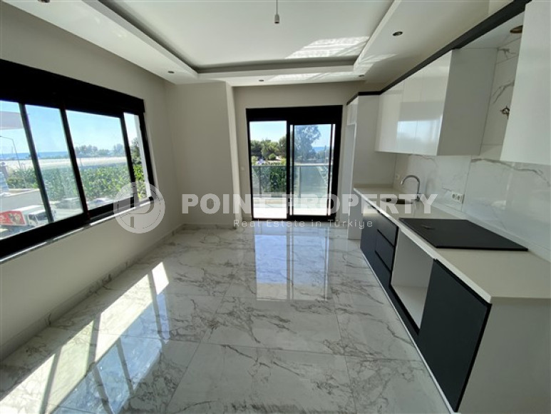 Новая уютная квартира 1+1 в 100 метрах от моря в районе Каргыджак.-id-3536-фото-2