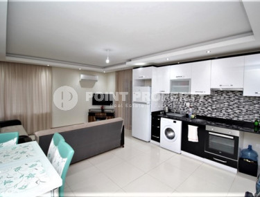 Обустроенные апартаменты 65 м2 с просторным остекленным балконом, район Тосмур-id-3549-фото-2