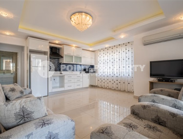 Просторная квартира с одной спальней в центре района Махмутлар.-id-3598-фото-2