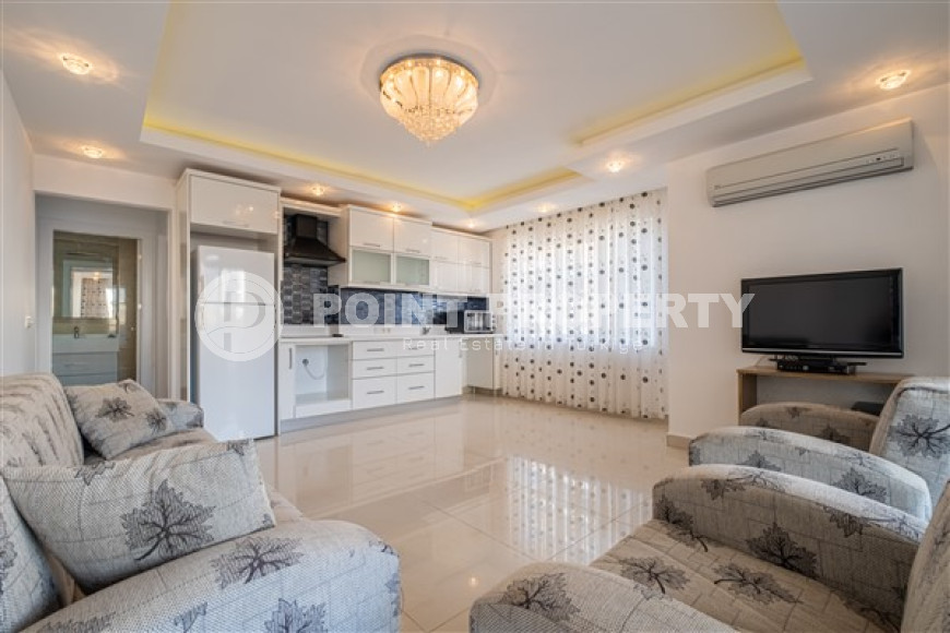Spacious one bedroom apartment in the center of Mahmutlar.-id-3598-photo-2