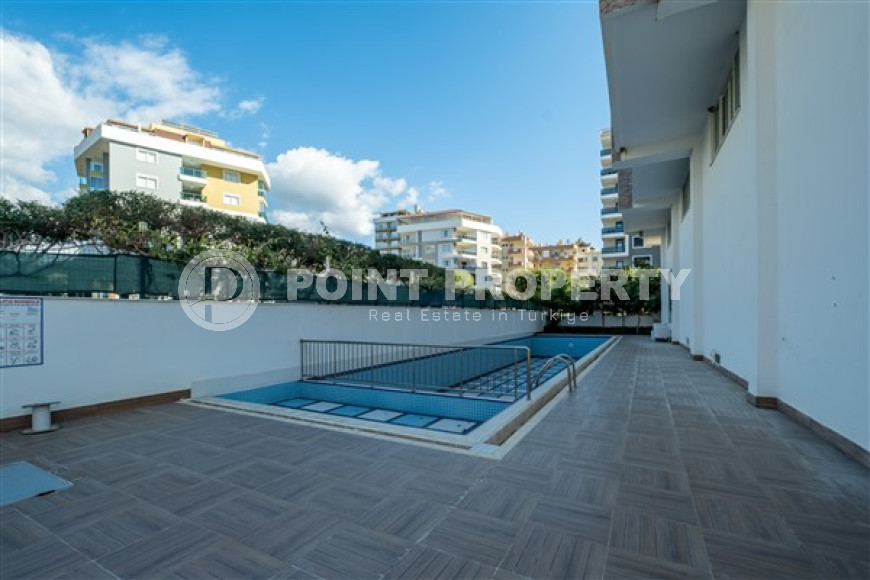 Просторная квартира с одной спальней в центре района Махмутлар.-id-3598-фото-7