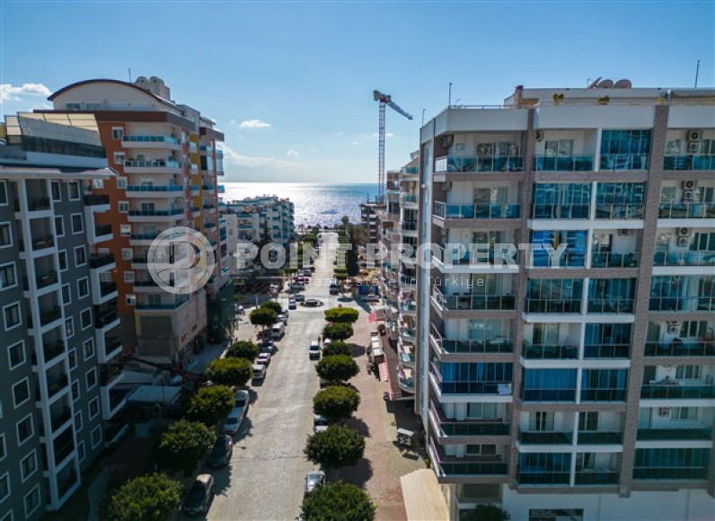 Просторная квартира с одной спальней в центре района Махмутлар.-id-3598-фото-11