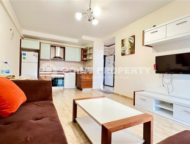 Компактная светлая квартира 1+1 в 300 метрах от  центра района Махмутлар.-id-3640-фото-2