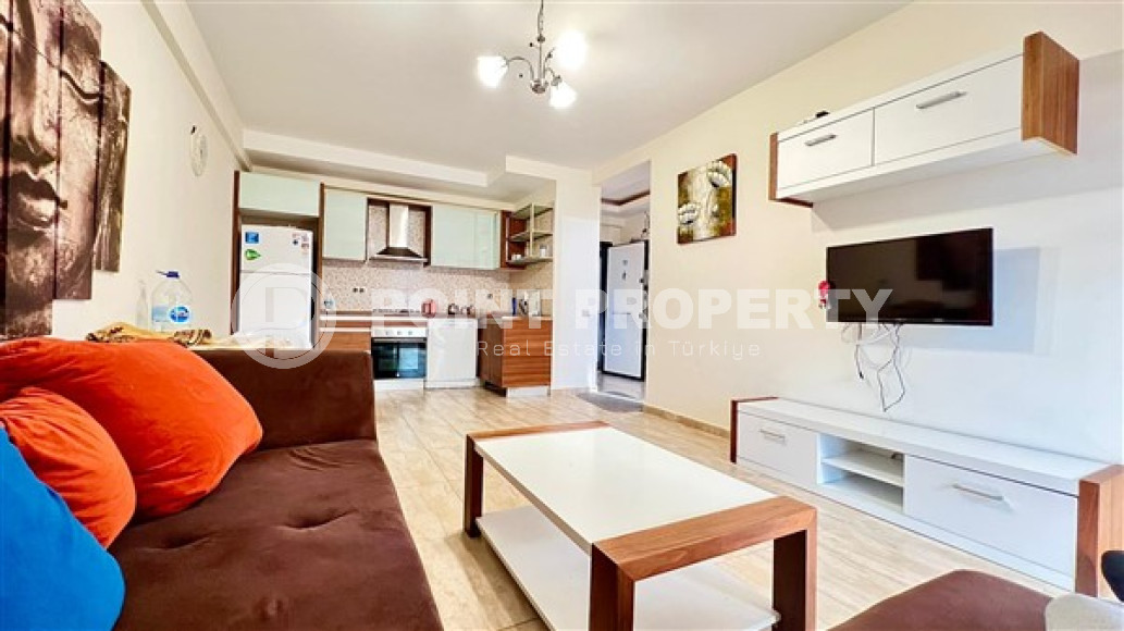 Компактная светлая квартира 1+1 в 300 метрах от  центра района Махмутлар.-id-3640-фото-2