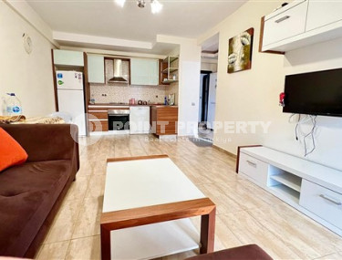 Компактная светлая квартира 1+1 в 300 метрах от  центра района Махмутлар.-id-3640-фото-3