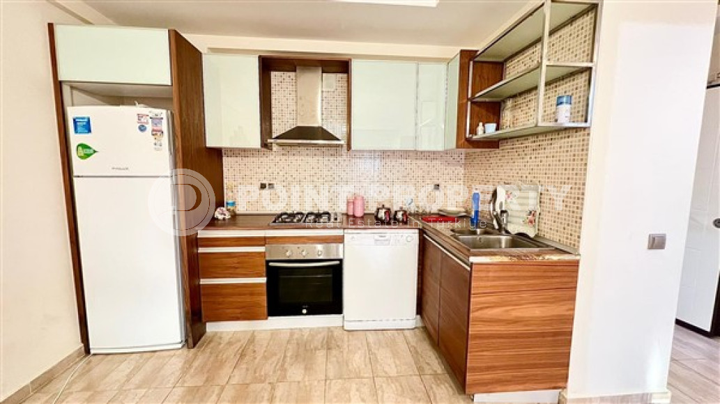 Компактная светлая квартира 1+1 в 300 метрах от  центра района Махмутлар.-id-3640-фото-5