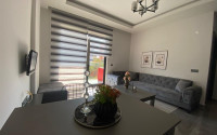Stylish one-bedroom apartment, 55m², in a cozy complex at the foot of the mountains in Oba, Alanya-id-1317-photo-1