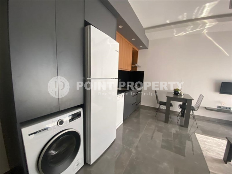 Stylish one-bedroom apartment, 55m², in a cozy complex at the foot of the mountains in Oba, Alanya-id-1317-photo-2