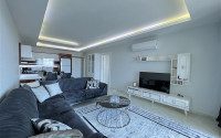 Furnished two-room apartment 80 m2 in a high-rise residence, Mahmutlar district-id-3693-photo-1