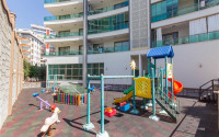 Furnished two-room apartment 80 m2 in a high-rise residence, Mahmutlar district-id-3693-photo-4