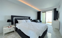 Furnished two-room apartment 80 m2 in a high-rise residence, Mahmutlar district-id-3693-photo-11