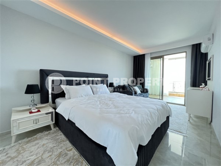 Furnished two-room apartment 80 m2 in a high-rise residence, Mahmutlar district-id-3693-photo-11
