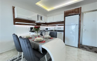 Furnished two-room apartment 80 m2 in a high-rise residence, Mahmutlar district-id-3693-photo-13