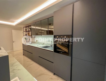 Просторный дуплекс 3+1 на 5-м этаже с мансардой в центре района Махмутлар.-id-3747-фото-4