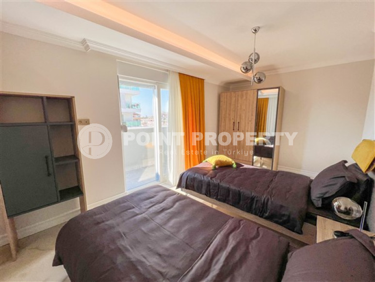 Spacious 3+1 duplex on the 5th floor with an attic in the center of Mahmutlar.-id-3747-photo-10