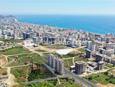 Apartments with layouts 1+1, 2+1, 3+1 in a complex under construction in Mahmutlar, 850 m to the sea-id-1042-photo-2