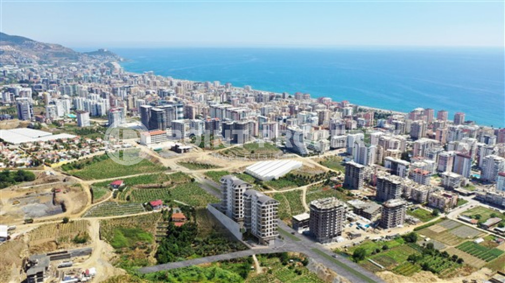 Apartments with layouts 1+1, 2+1, 3+1 in a complex under construction in Mahmutlar, 850 m to the sea-id-1042-photo-2