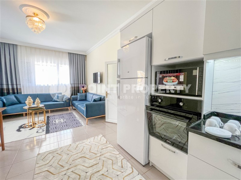 Cozy one-bedroom apartment in the sought-after area of Mahmutlar, just 50 meters from the sea.-id-1325-photo-9