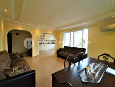 Furnished apartment 2+1, with a total area of 120 m2, on the 4th floor in the center of Mahmutlar.-id-3863-photo-2