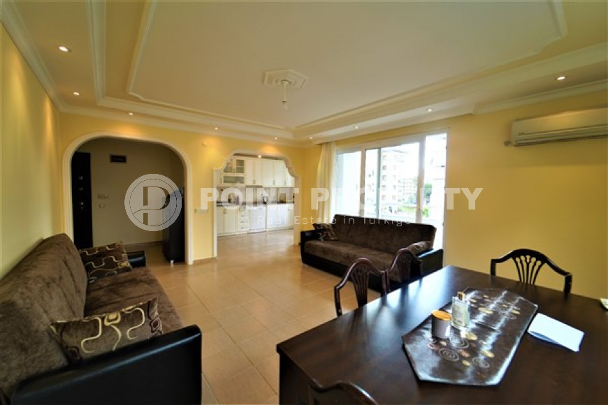 Furnished apartment 2+1, with a total area of 120 m2, on the 4th floor in the center of Mahmutlar.-id-3863-photo-2