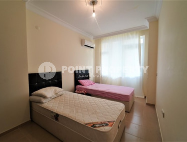 Furnished apartment 2+1, with a total area of 120 m2, on the 4th floor in the center of Mahmutlar.-id-3863-photo-4