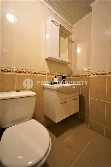 Furnished apartment 2+1, with a total area of 120 m2, on the 4th floor in the center of Mahmutlar.-id-3863-photo-11